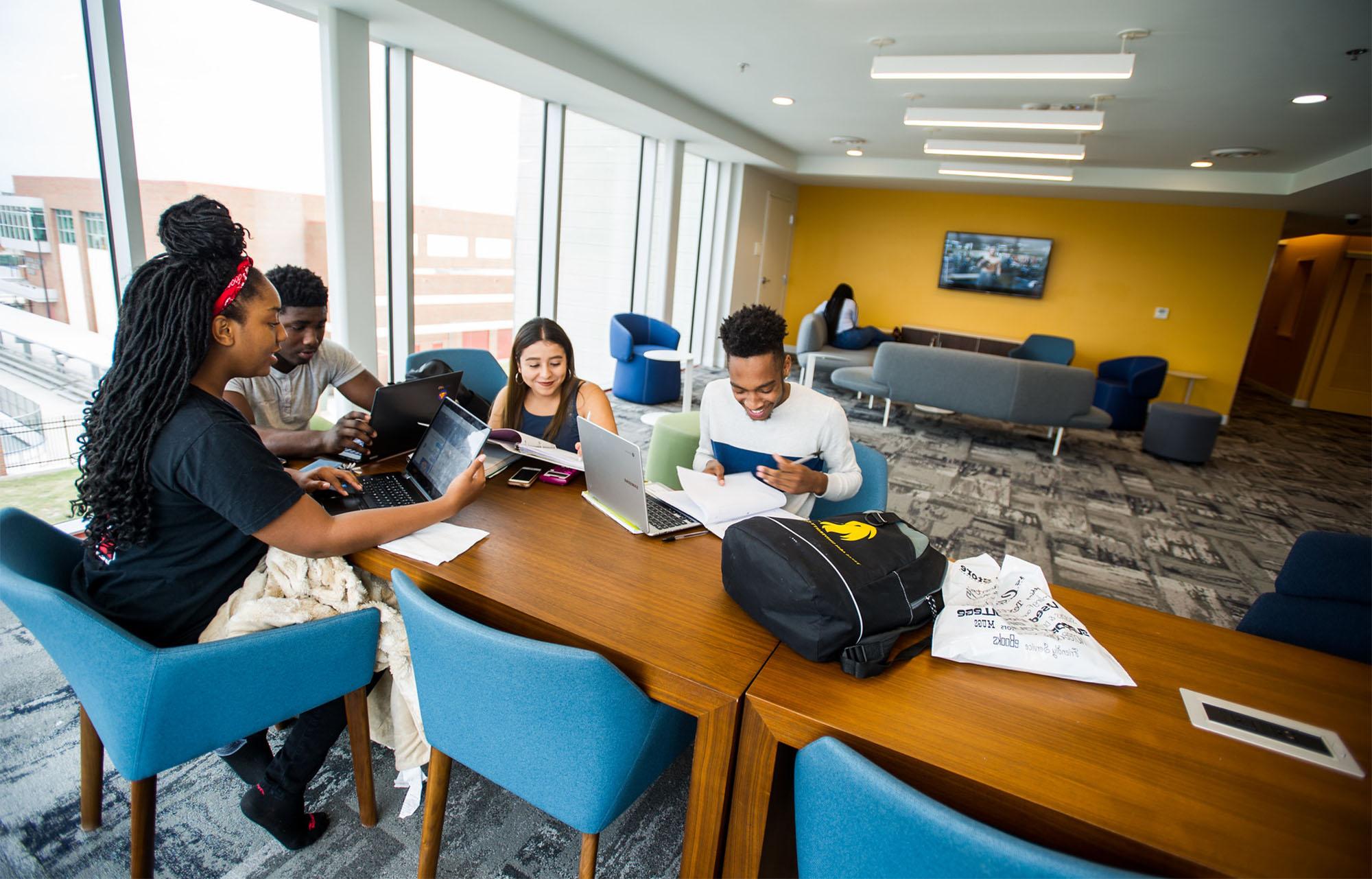 A group of students completing an assignment together.